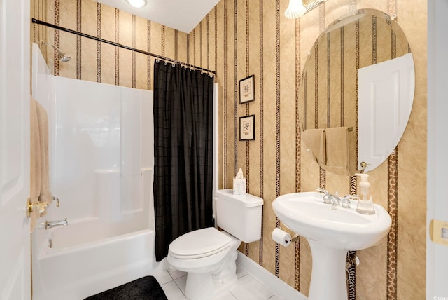 full bathroom featuring toilet, shower / bathtub combination with curtain, wallpapered walls, and tile patterned floors