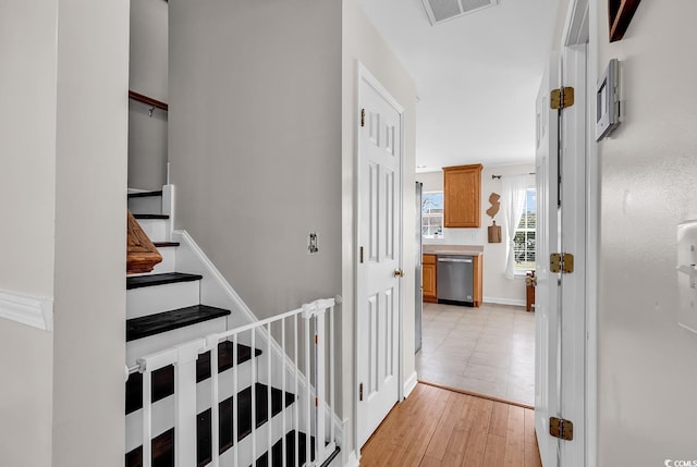 2629 Scarecrow Way, Myrtle Beach, SC 29579 - hall with an upstairs landing, light wood-style flooring, and baseboards