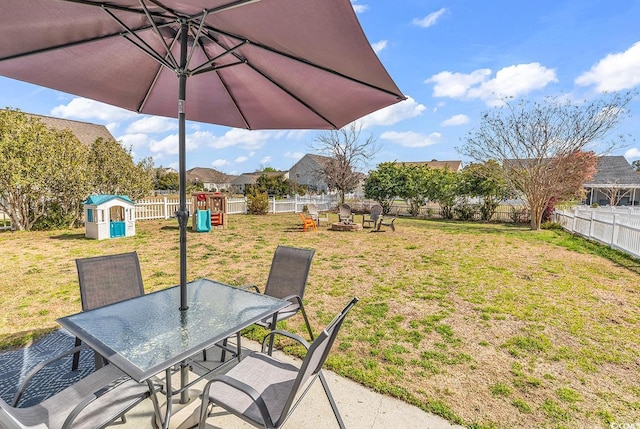 2629 Scarecrow Way, Myrtle Beach, SC 29579 - view of yard with a playground, outdoor dining space, a fire pit, and a patio
