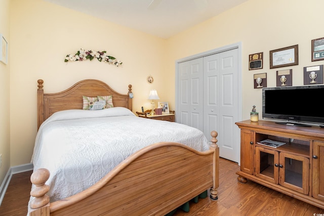 bedroom with a closet and wood finished floors