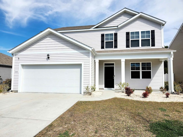 5088 Wavering Place Loop, Myrtle Beach, SC 29579 - view of front facade with covered porch, a garage, driveway, and a front lawn