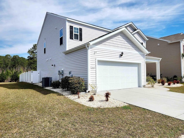 5088 Wavering Place Loop, Myrtle Beach, SC 29579 - view of side of home with central AC unit, driveway, a lawn, and an attached garage
