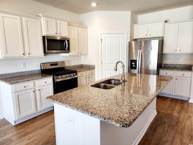 5088 Wavering Place Loop, Myrtle Beach, SC 29579 - kitchen with appliances with stainless steel finishes, a sink, wood finished floors, white cabinets, and recessed lighting