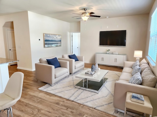 5088 Wavering Place Loop, Myrtle Beach, SC 29579 - living room featuring wood finished floors, a ceiling fan, and baseboards