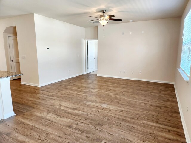 5088 Wavering Place Loop, Myrtle Beach, SC 29579 - empty room with ceiling fan, wood finished floors, and baseboards