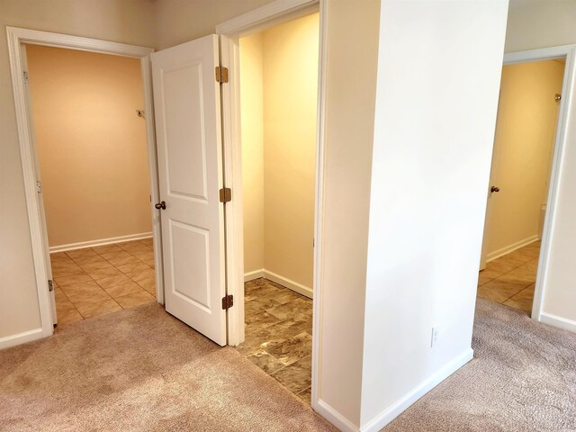 5088 Wavering Place Loop, Myrtle Beach, SC 29579 - hallway with carpet floors, baseboards, and tile patterned floors