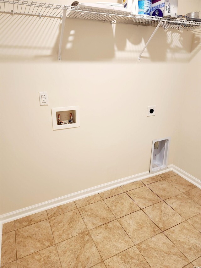 5088 Wavering Place Loop, Myrtle Beach, SC 29579 - clothes washing area featuring hookup for a washing machine, tile patterned floors, baseboards, and hookup for an electric dryer