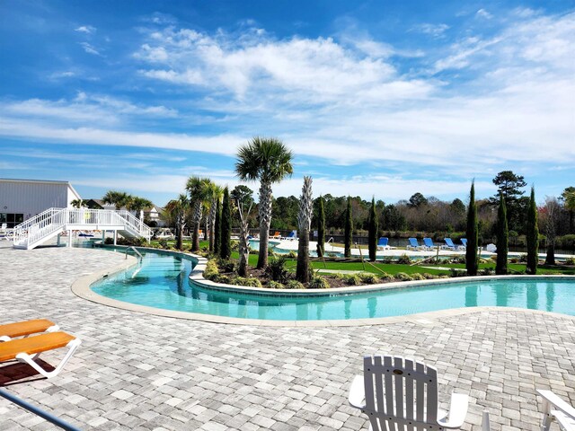 5088 Wavering Place Loop, Myrtle Beach, SC 29579 - community pool featuring a patio area