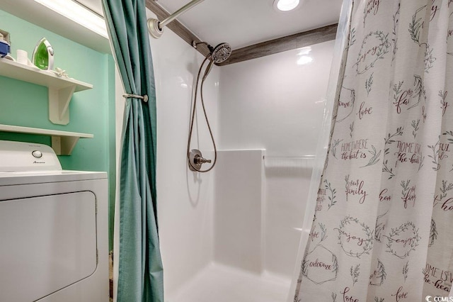 full bathroom with washer / clothes dryer and curtained shower