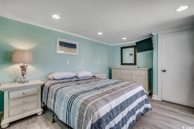 bedroom with crown molding, recessed lighting, baseboards, and light wood-style flooring