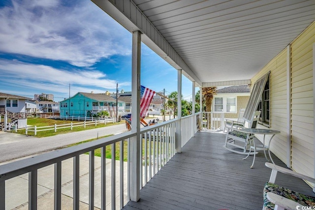 wooden deck featuring a residential view