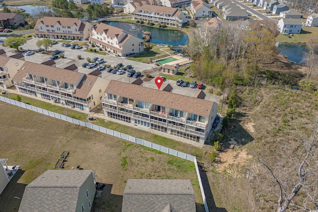 birds eye view of property with a residential view and a water view