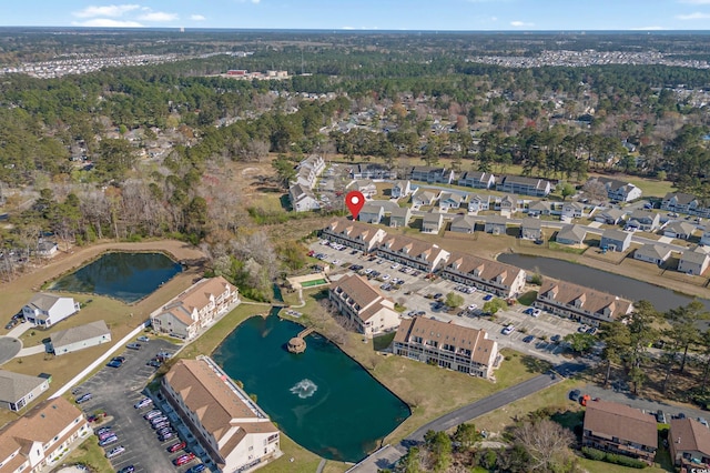 bird's eye view featuring a residential view and a water view