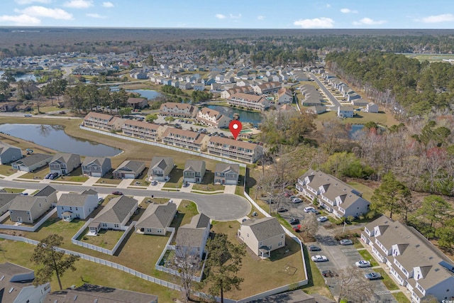 aerial view featuring a residential view and a water view