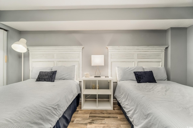 bedroom with wood finished floors