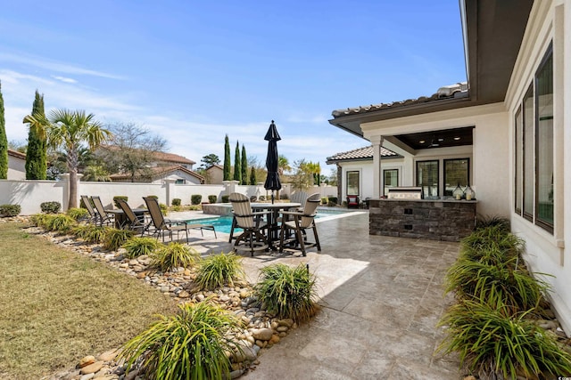 view of patio featuring a fenced backyard, a fenced in pool, and outdoor dining area