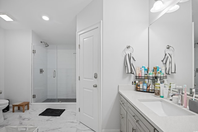 bathroom featuring toilet, marble finish floor, a stall shower, recessed lighting, and vanity