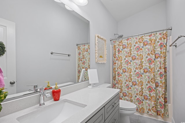 full bathroom featuring toilet, shower / tub combo with curtain, vanity, and tile patterned flooring