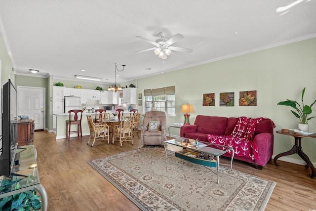 3927 Gladiola Ct Unit 101, Myrtle Beach, SC 29588 - living area with crown molding, ceiling fan, light wood-style flooring, and baseboards