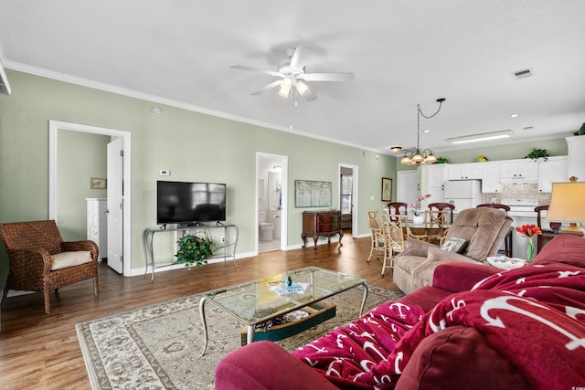 3927 Gladiola Ct Unit 101, Myrtle Beach, SC 29588 - living room featuring ceiling fan, crown molding, light wood-style floors, a chandelier, and baseboards
