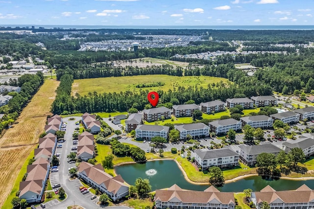 3927 Gladiola Ct Unit 101, Myrtle Beach, SC 29588 - drone / aerial view of a large body of water and a tree filled landscape