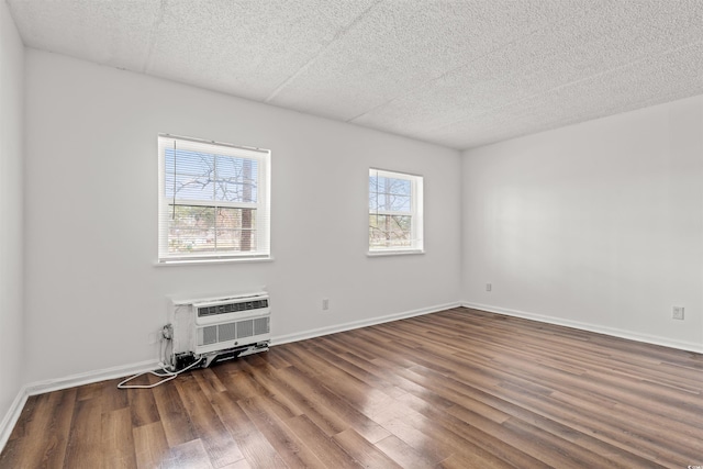 6850 Blue Heron Blvd Unit 205, Myrtle Beach, SC 29588 - spare room with a healthy amount of sunlight, wood finished floors, and a wall unit AC