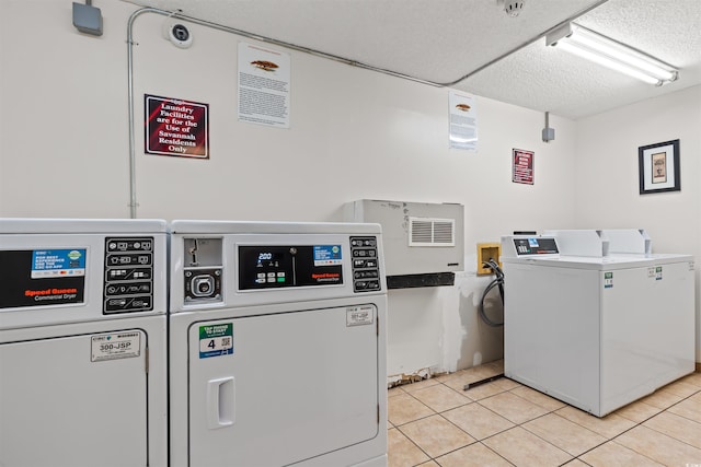 6850 Blue Heron Blvd Unit 205, Myrtle Beach, SC 29588 - shared laundry area featuring independent washer and dryer and light tile patterned flooring