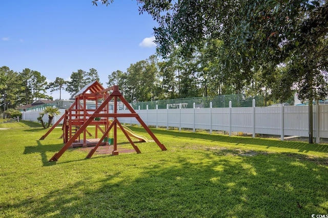 6850 Blue Heron Blvd Unit 205, Myrtle Beach, SC 29588 - view of play area featuring a yard and fence