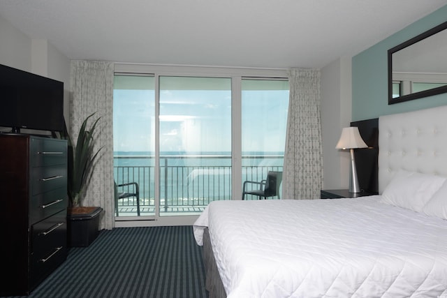 107 S Ocean Blvd Unit 704, Myrtle Beach, SC 29577 - bedroom featuring a water view, carpet flooring, and access to outside