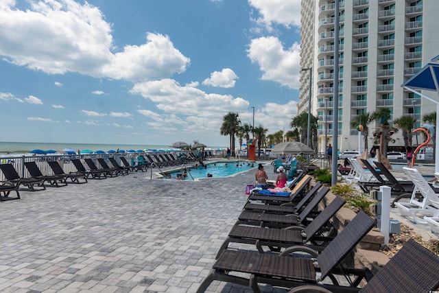 107 S Ocean Blvd Unit 704, Myrtle Beach, SC 29577 - pool featuring a patio and a water view