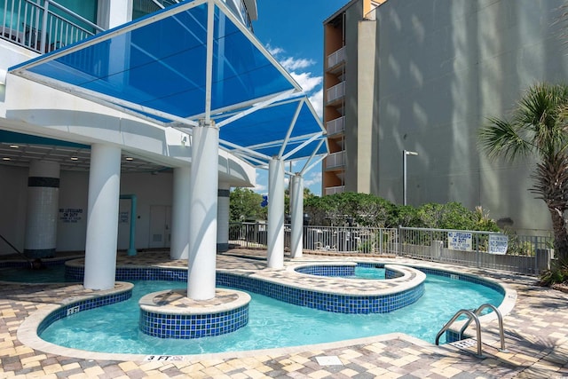 107 S Ocean Blvd Unit 704, Myrtle Beach, SC 29577 - community pool with fence, a patio, and a community hot tub