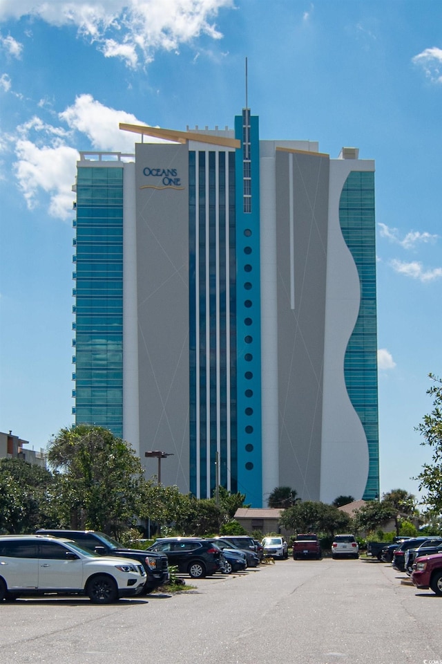 107 S Ocean Blvd Unit 704, Myrtle Beach, SC 29577 - view of building exterior with uncovered parking