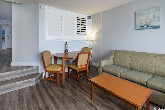 living area with wood finished floors and baseboards