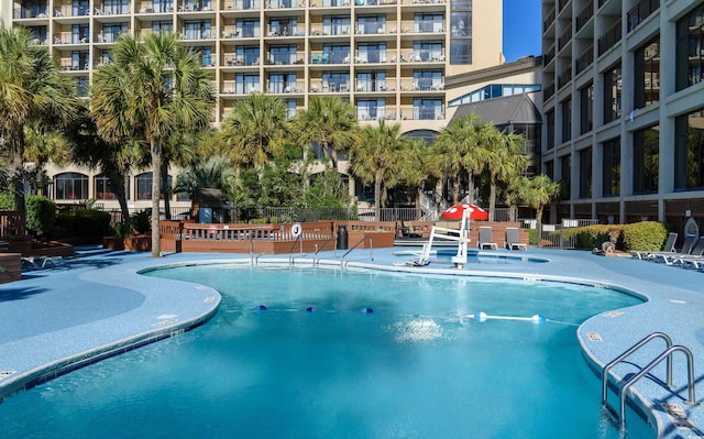 community pool with fence