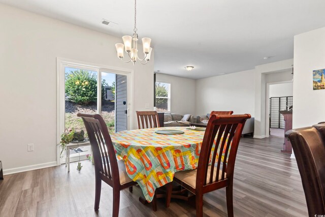 2848 Ophelia Way, Myrtle Beach, SC 29577 - dining area featuring wood finished floors, a chandelier, and baseboards
