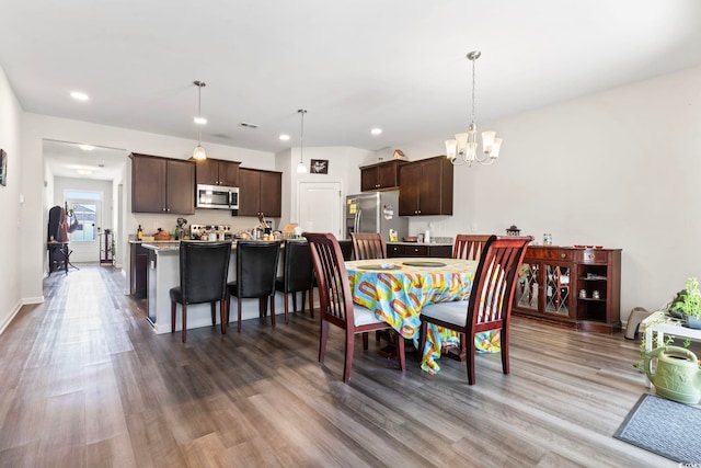 2848 Ophelia Way, Myrtle Beach, SC 29577 - dining space featuring a chandelier, wood finished floors, and recessed lighting