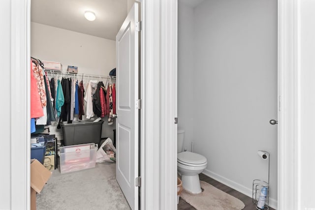 2848 Ophelia Way, Myrtle Beach, SC 29577 - bathroom featuring toilet, a walk in closet, and baseboards