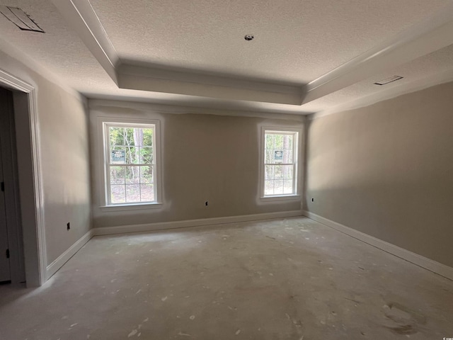 2929 Hughes Gasque Rd, Aynor, SC 29511 - unfurnished room with a textured ceiling, unfinished concrete floors, a raised ceiling, and baseboards