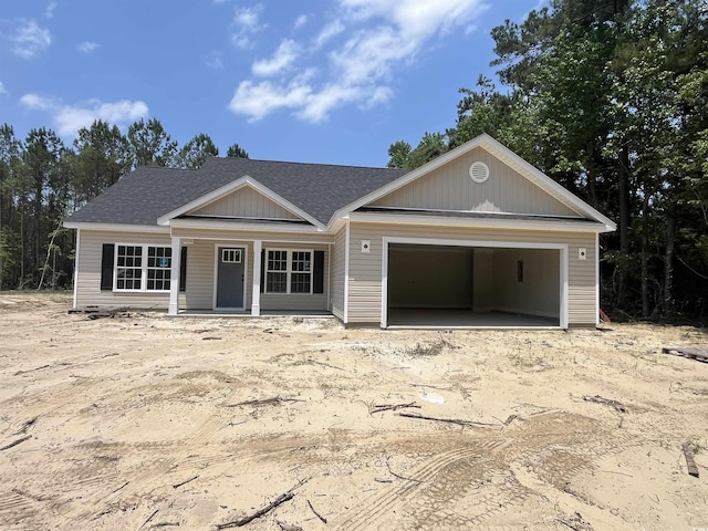 2929 Hughes Gasque Rd, Aynor, SC 29511 - view of front of home featuring roof with shingles, a garage, and covered porch