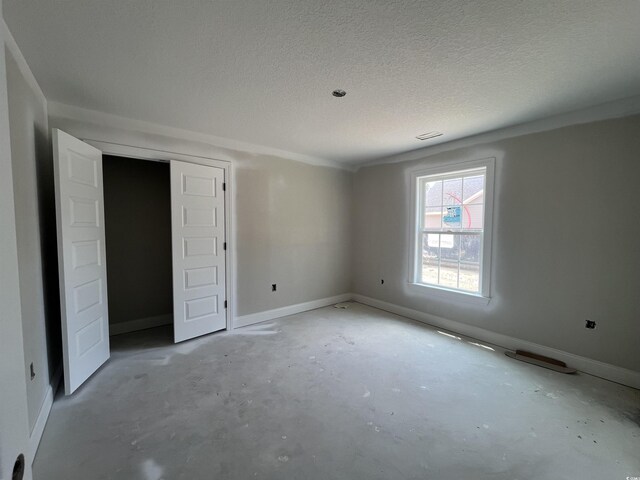 2929 Hughes Gasque Rd, Aynor, SC 29511 - unfurnished bedroom featuring baseboards, a textured ceiling, and unfinished concrete flooring