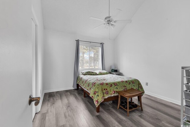 500 Fairway Village Dr Unit 7-D, Myrtle Beach, SC 29588 - bedroom featuring wood finished floors, lofted ceiling, baseboards, and a ceiling fan