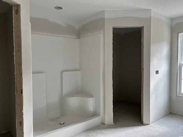 bathroom featuring a stall shower