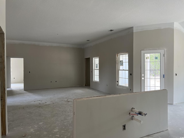 2921 Hughes Gasque Rd, Aynor, SC 29511 - unfurnished living room with healthy amount of natural light and a textured ceiling