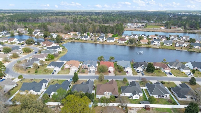bird's eye view with a residential view and a water view