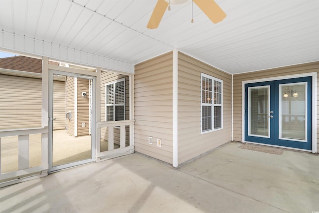 unfurnished sunroom featuring french doors and ceiling fan
