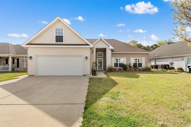 view of front of house with concrete driveway and a front lawn