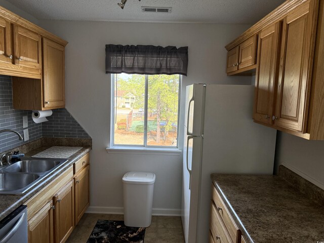 380-K Myrtle Greens Dr Unit 380-K, Conway, SC 29526 - kitchen featuring dark countertops, visible vents, decorative backsplash, dishwasher, and a sink