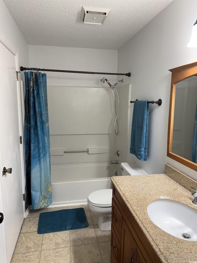 full bathroom featuring vanity, shower / bath combination with curtain, a textured ceiling, and toilet