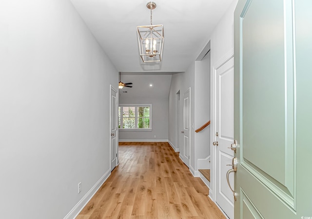 19 Coventry Pl, Pawleys Island, SC 29585 - corridor with a chandelier, light wood finished floors, and baseboards