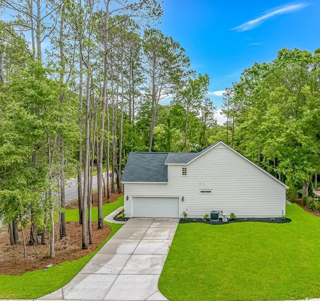 19 Coventry Pl, Pawleys Island, SC 29585 - view of home's exterior with a yard, driveway, a garage, and view of scattered trees